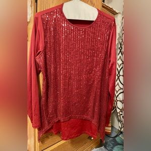 front sequin, silky, long sleeve top with stretch. Says 2x but fits like an XL.